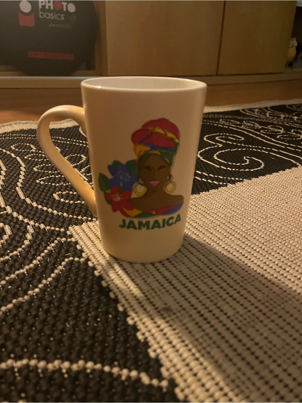 Mug with lady on it says JAMAIC New